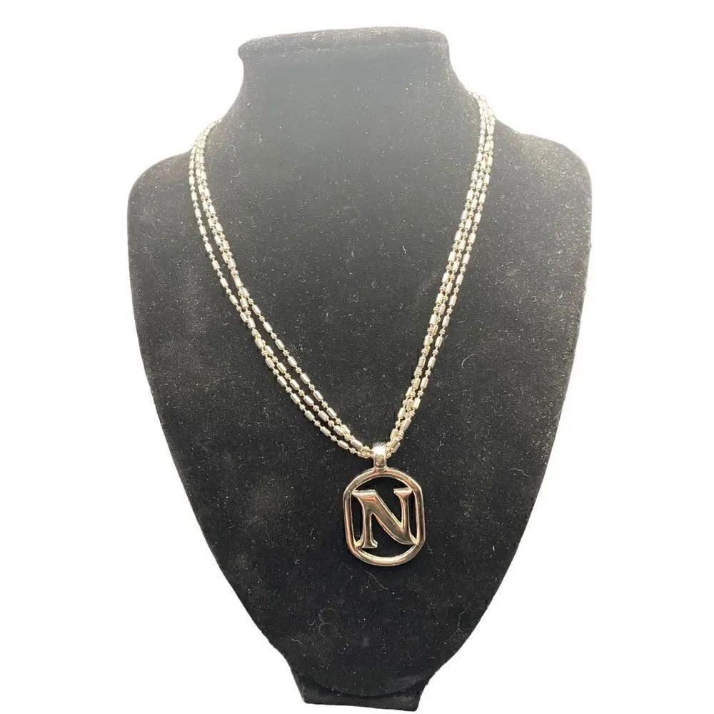 Three chain silver tone necklace with monogram “N” heart clasps